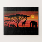 Puzzle Les animaux africains dans un coucher de soleil du (Horizontal)
