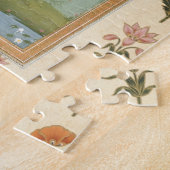 Puzzle Madame tenant une fleur, se tenant prêt un étang (Côté)