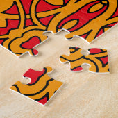 Puzzle Motif à main orange et rouge (Côté)