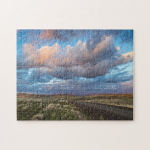 Puzzle Nuages de coucher de soleil sur la route de la pra