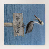 Puzzle Pélican avec poisson sur un panneau 'Pêche interdi (Horizontal)