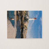 Puzzle Phare sur rochers avec réflexion océanique (Horizontal)