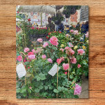 Puzzle Plantes de marché français<br><div class="desc">Ce puzzle présente une photo d'un stand de vente de plantes sur un marché en France.</div>