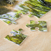 Puzzle Raccoon nage dans l'eau de rivière (Côté)