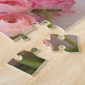 Puzzle ranunculus rose sur arrière - plan texturé (Côté)