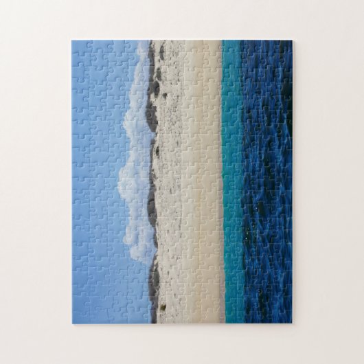 Puzzle Ressacs sur la plage sablonneuse sous le ciel bleu (Vertical)