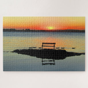 Puzzle siège de coucher de soleil sur le lac