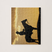 Puzzle Silhouette de cowboy à cheval au coucher du soleil (Vertical)