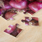 Puzzle Tas des oignons rouges sur le marché (Côté)
