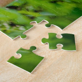 Puzzle Tigre Adulte Prowling Parmi Les Feuilles Vert Clai (Côté)