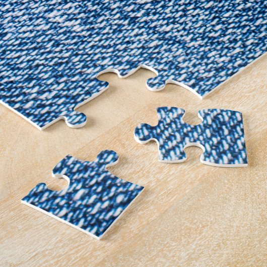 Puzzle Tissu en denim déchiré, teintes bleues. (Côté)