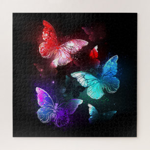 Puzzle Trois papillons lumineux sur fond de nuit