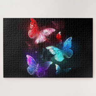 Puzzle Trois papillons lumineux sur fond de nuit
