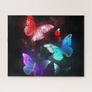 Puzzle Trois papillons lumineux sur fond de nuit