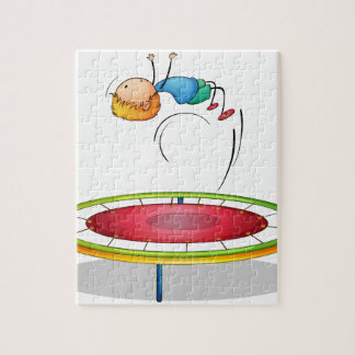 Puzzle Un garçon jouant le trempoline