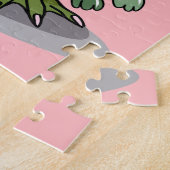 Puzzle Un Hadrosaurus Féminin Tenant Une Poupée. (Côté)