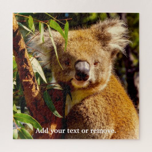 Puzzle Un joli ours brun koala mangeant des feuilles d'eu (Vertical)