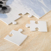Puzzle Un léopard des neiges sur un pic enneigé (Côté)