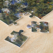 Puzzle Une femme avec un parasol dans un jardin par Augus (Côté)