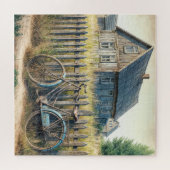 Puzzle Vieux vélo abandonné sur une clôture rustique (Horizontal)