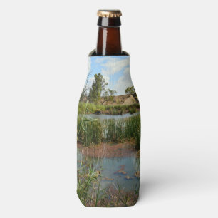 Rafraichisseur De Bouteilles Grenouille sur des roseaux surplombant son marais,