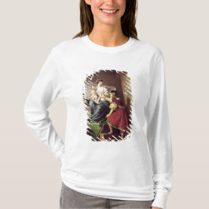 Raphael past zijn model aan t-shirt