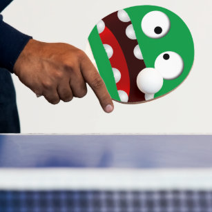 Raquette De Ping Pong caricature verte effrayée visage monstre