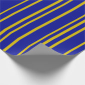 Rayures dorées et bleues sur du papier cadeau (Coin)