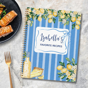 Receptenboek met gele citroenfruit en blauwe strep notitieboek