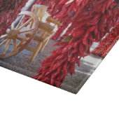 Red Chile Pepper Ristra sur une planche à découper (Coin)