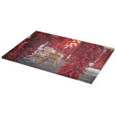 Red Chile Pepper Ristra sur une planche à découper (Coin)