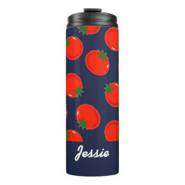 Red tomatoen on blue thermosbeker