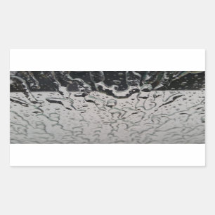 Regen valt op het raam rechthoekige sticker