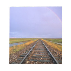 Regenboog boven spoorrails bij Fairfield Notitieblok