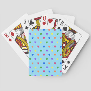 Regenboog stippenharten op babyblauw pokerkaarten