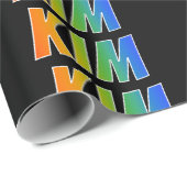 Regenboogvoornaam "KIM"; vun en kleurrijk Cadeaupapier (Rol Hoek)