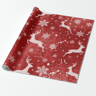 rendieren en sneeuwvlokken op rode achtergrond cadeaupapier