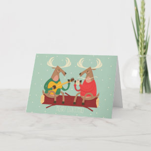 Renne décorant la carte de vacances d'arbre de