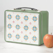 Retro green lunchbox with a floral tile pattern  (In situ)