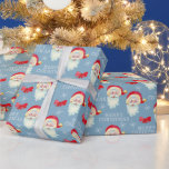Retro Père Noël sur Pastel Blue Christmas<br><div class="desc">Ce papier d'emballage cadeau de Noël classique offre un arrière - plan bleu pastel avec un graphique du Père Noël. Le design est accentué de flocons de neige et d'arc et le texte "MERRY CHRISTMAS".</div>