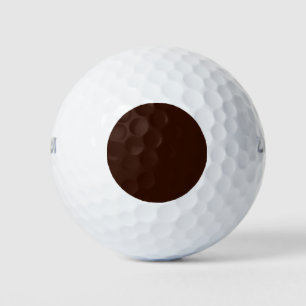 Rich Brown-kleurenachtergrond Golfballen