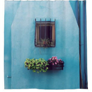 RIDEAUX DE DOUCHE WINDOW WITH FRAME ABOVE GREEN AND PINK PETALED FLO