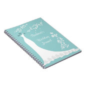 Robe blanche sur le carnet de wedding planner (Côté Droit)
