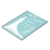 Robe blanche sur le carnet de wedding planner (Côté gauche)