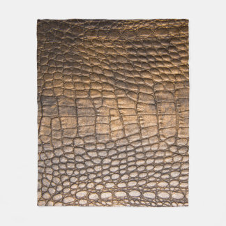 ?Rocodilleder. Achtergrond bruin leder en de bruin Fleece Deken