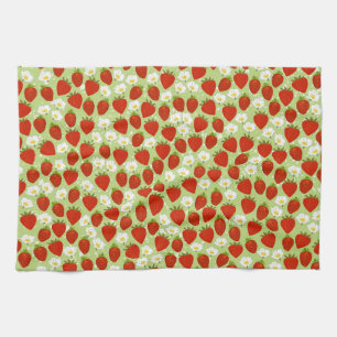 Rode aardbeien en bloemen met groene theedoek