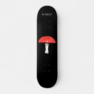 Rode agarische vliegenpaddenstoel met monogram skateboard