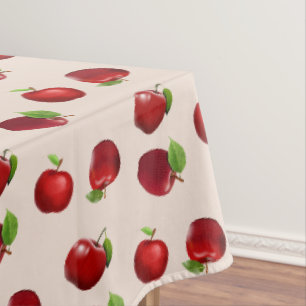Rode appels op lichtbeige tafelkleed