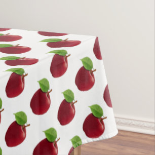 Rode appels op wit tafelkleed