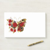 Rode bloem vlinder met rode rozen post-it® notes (Op bureau)